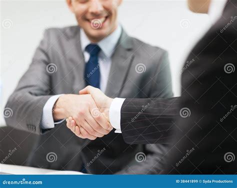 businessmen shaking hands  office royalty  stock images
