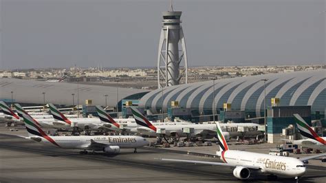 drones temporarily ground takeoffs  dubai airport leaving thousands stranded rt world news