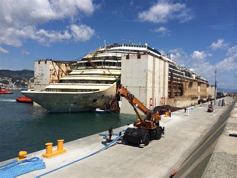 costa concordia arrives  genoa marks completion  largest maritime salvage project