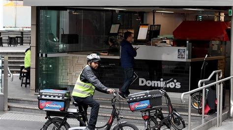 dominos employees agree   wages deal sbs news