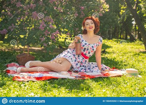 Red Haired Happy Pin Up Girl In Vintage Summer Dress And