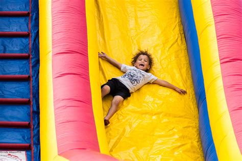 child sliding  inflatable birmingham christian family magazine