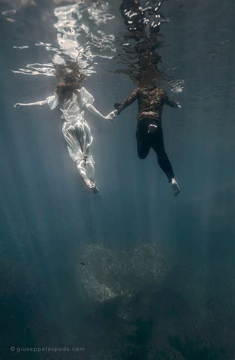 amor fugit… underwater love heart couple sea lovers underwater art background for