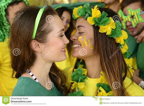women soccer fans almost kissing each other stock image