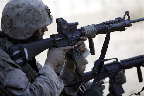 A U S Marine Armed With An M16a4 Rifle And Itl Mars Sight