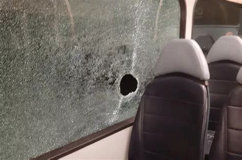 rock hurled  bus window  scared passengers  board liverpool echo