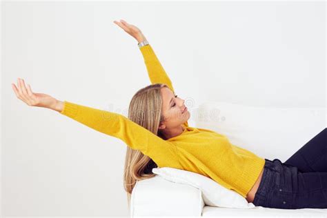 Woman Stretching On A Couch Stock Image Image Of Adult Relaxation