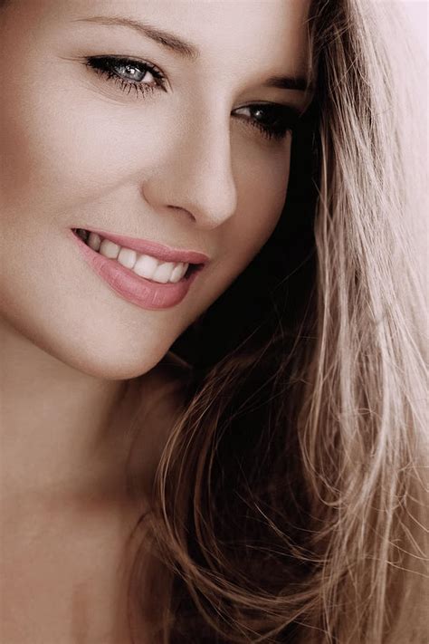 elegant woman smiling brunette with long light brown hair