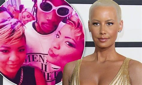 amber rose split with wiz khalifa after walking in on him with twin