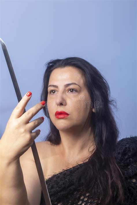 portrait of a european woman with a sword in her hands