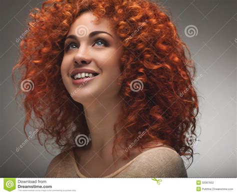 red hair beautiful woman with curly long hair high quality ima stock