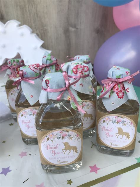small jars filled  honey sitting  top   table   balloons  confetti