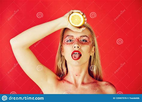 Pretty Blonde Woman With Creative Fashionable Makeup Hold Lemon