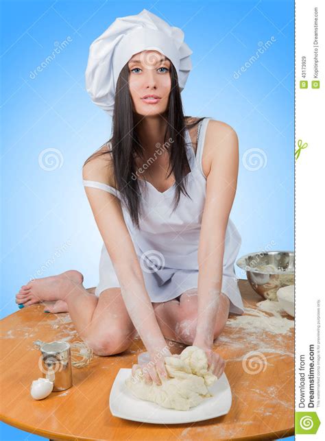 Sexy Girl Wearing Chef Prepares Dough Royalty Free Stock Image