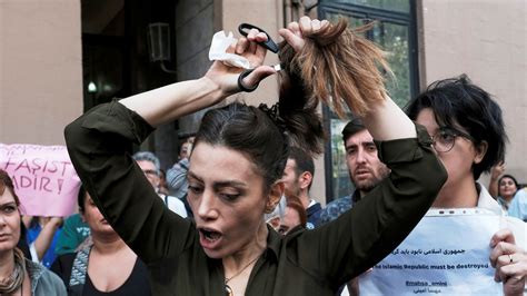 iran protests   mahsa amini   women cutting  hair