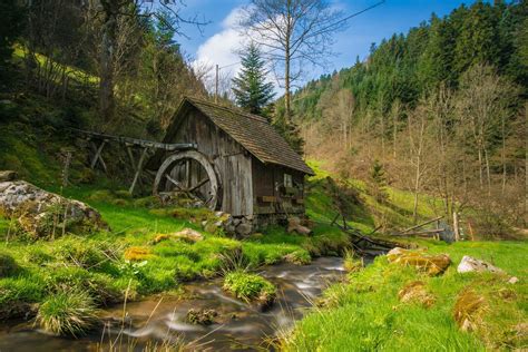 brown wooden house  river  mountain  blue skies hd