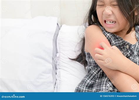 Girl Scratch The Itch With Hand On Bed Royalty Free Stock Image