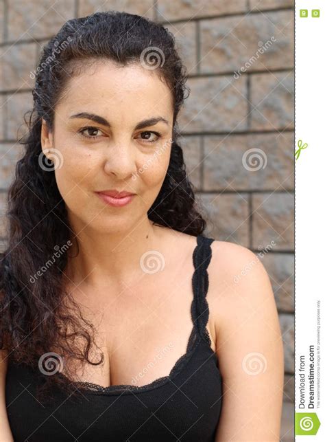 Dressed Mature Woman On Textured Wall Stock Image Image