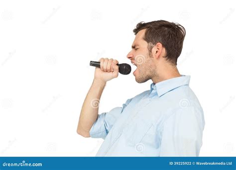 side view   young man singing  microphone stock photo image