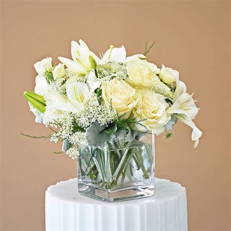 Snow White All White Flowers Arrangement Of Lilies