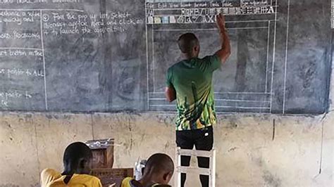 ghanaian teacher draws microsoft word   blackboard