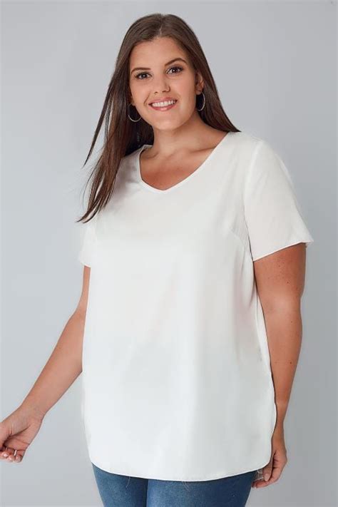 ivory woven top with v neck and curved hem plus size 16 to 36