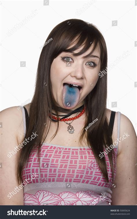 Portrait Of A Teen Girl Sticking Out Her Tongue Her Tongue Is Colored