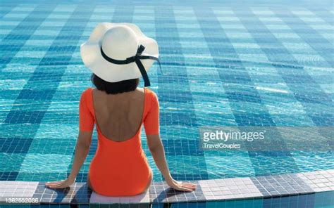 asian woman wear sunglass sunbathing photos and premium high res