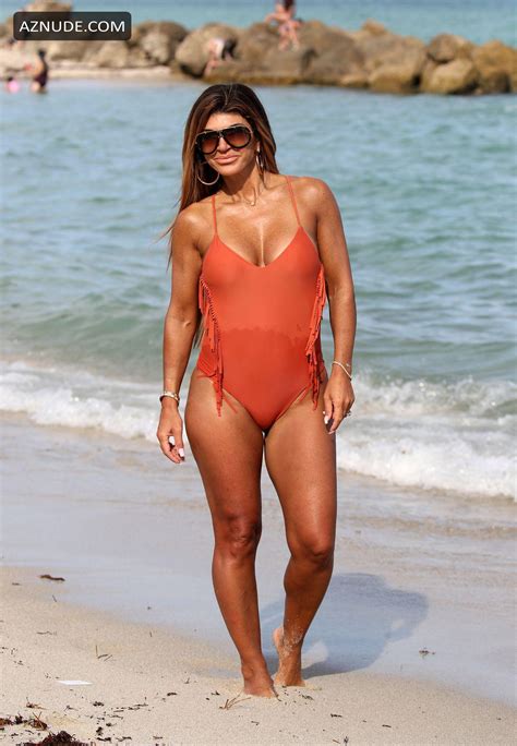 teresa giudice in a peach one piece swimsuit as she takes a stroll