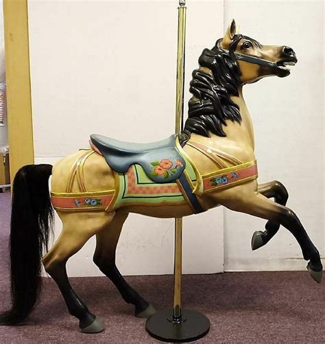 carousel horse  standing   hind legs    black mane   orange flower