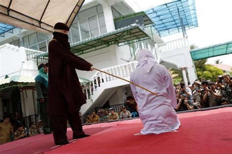 shocking moment four couples in indonesia are dragged into busy square and whipped for having