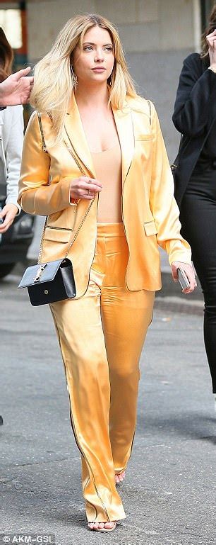 ashley benson stands out in new york in orange satin suit daily mail online