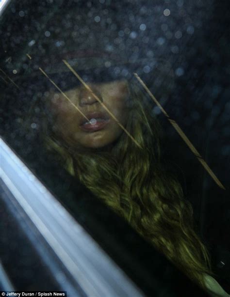 chrissy teigen enjoys quick snooze as she slumps in the back of a car