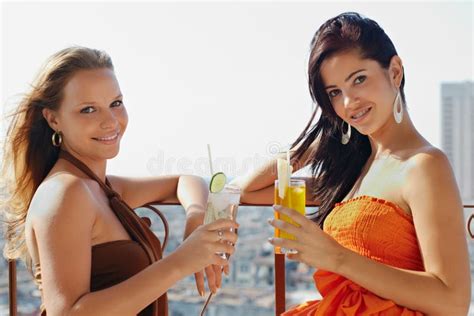 Two Girls On Holidays In Cuba Holding Cocktails Stock Image Image Of