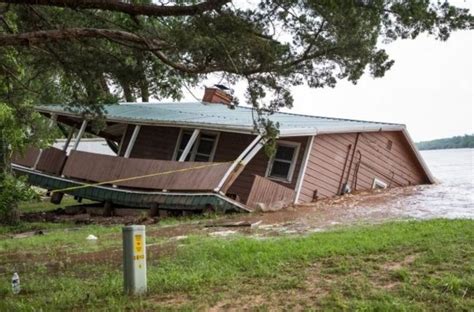 home in logan county falls into cimarron river wednesday