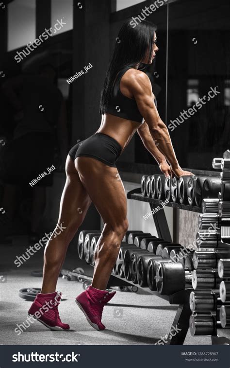 muscular woman working out gym strong stockfoto 1288728967 shutterstock
