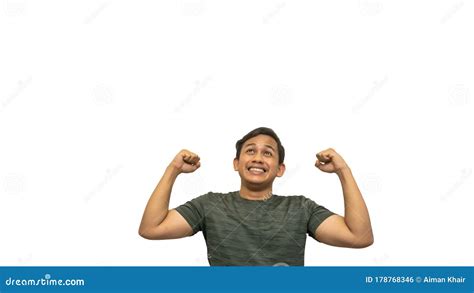 happy  excited face expression  young asian malay man celebrating