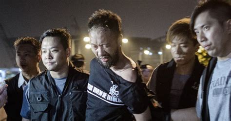 hong kong police kick and punch handcuffed protestor in