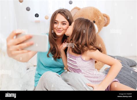Two Beautiful Girls Kissing Smiling Stockfotos And Two Beautiful Girls