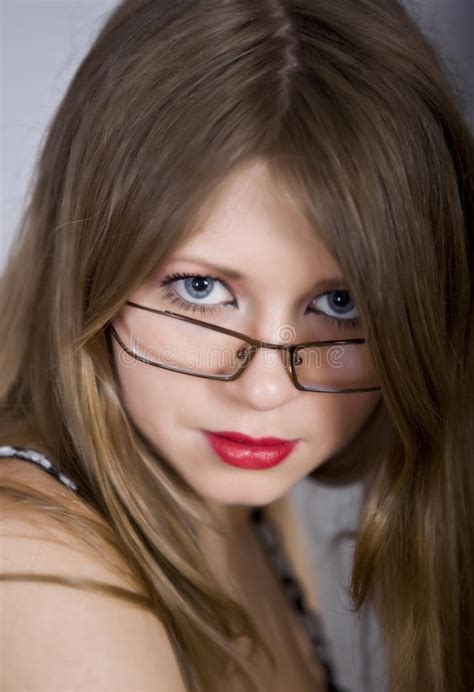 Beautiful Girl Blonde With Blue Eyes And Glasses Stock
