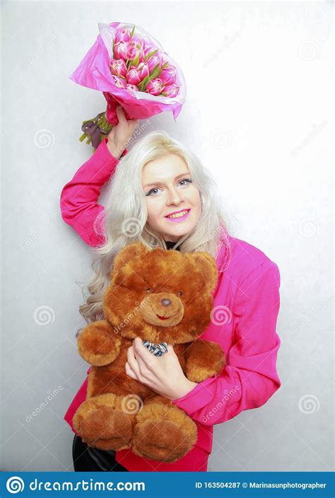 tender pretty blonde slim teen girl with pink flowers