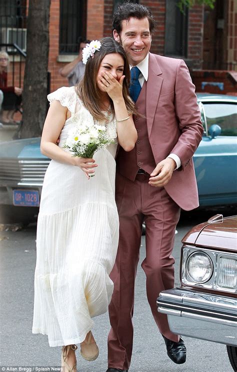 mila kunis slips on a seventies style wedding dress to