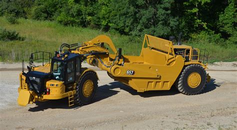 cat bolsters earthmoving credentials    wheel tractor scraper international mining