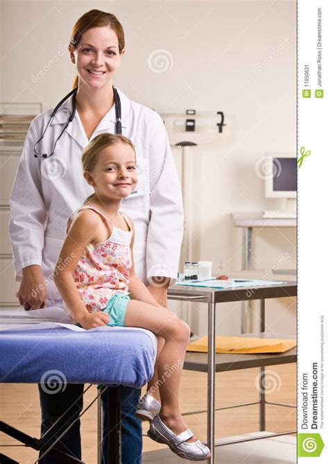 doctor giving girl checkup in doctor office stock image image 17050631