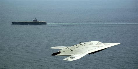 heres  navys sleek  stealth fighter drone  action