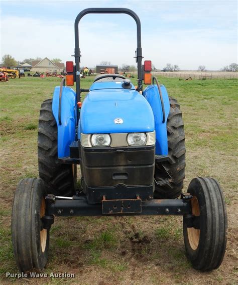 holland  workmaster mfwd tractor  davis  item gc sold purple wave