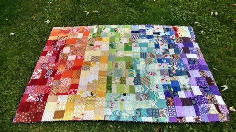 finished rainbow scrap quilt    footer quilting