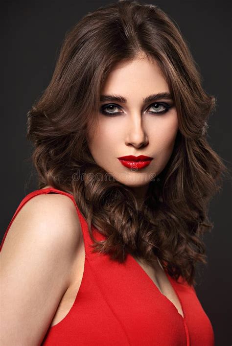 Beautiful Bright Makeup Woman With Long Brown Curly Volume Hair Style