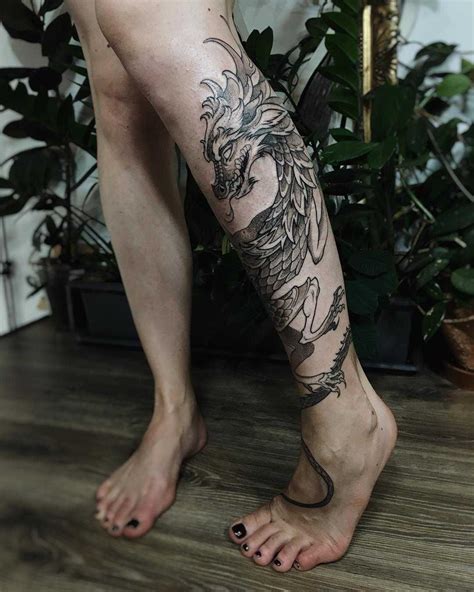 Cool Dragon Tattoo Wrapped Around The Left Calf Dragon Tattoo Leg