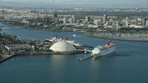 stock footage aerial video   cruise ship  queen mary docked  downtown long beach